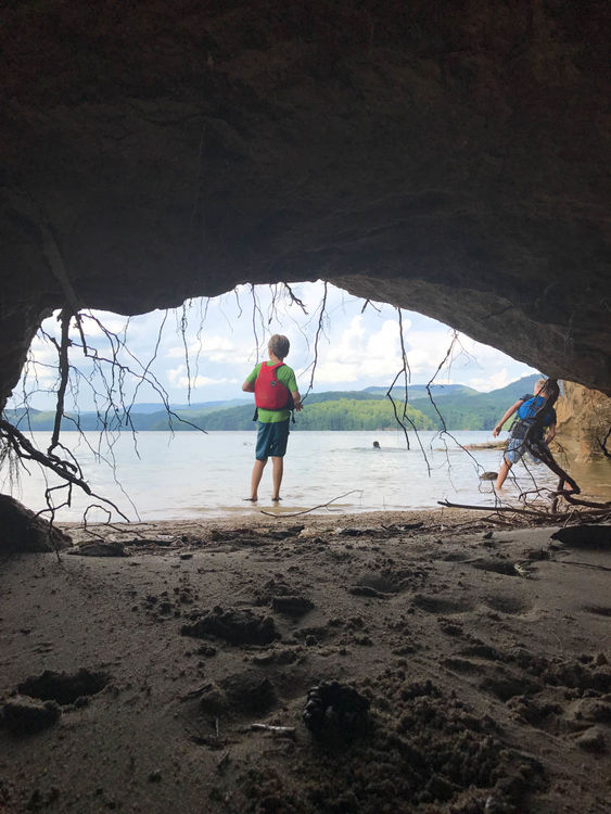 Skipping rocks outside one of the Lake Jocassee caves