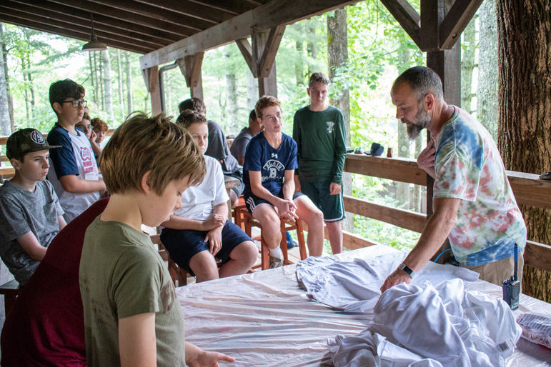 Drew giving boys tips on tie dye methods