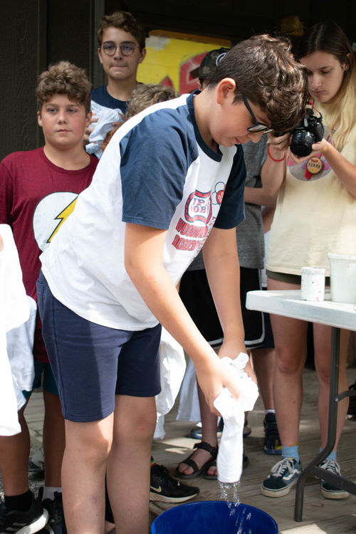Dipping the shirts in soda ash water before dying them
