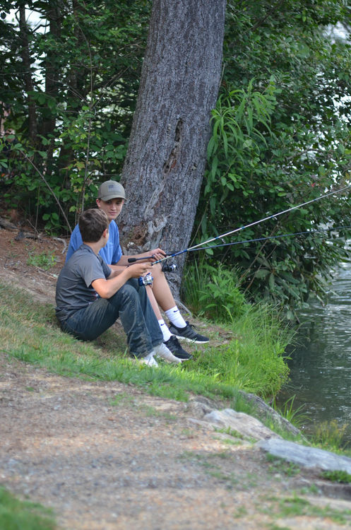 Enjoying camp’s serenity with a fishing pole during Free Time today
