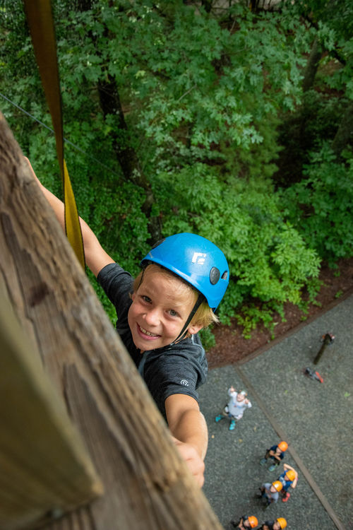 Reaching the top of the climbing wall!