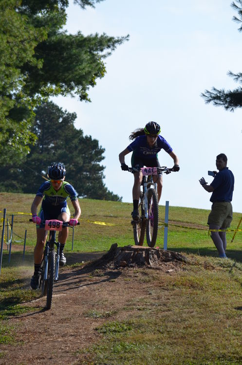 Allison passing her competition by jumping past her in the Mars Hill Cross Country Race on 10-6-13