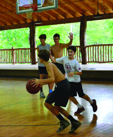 Campers playing basketball in our camp gymnasium.