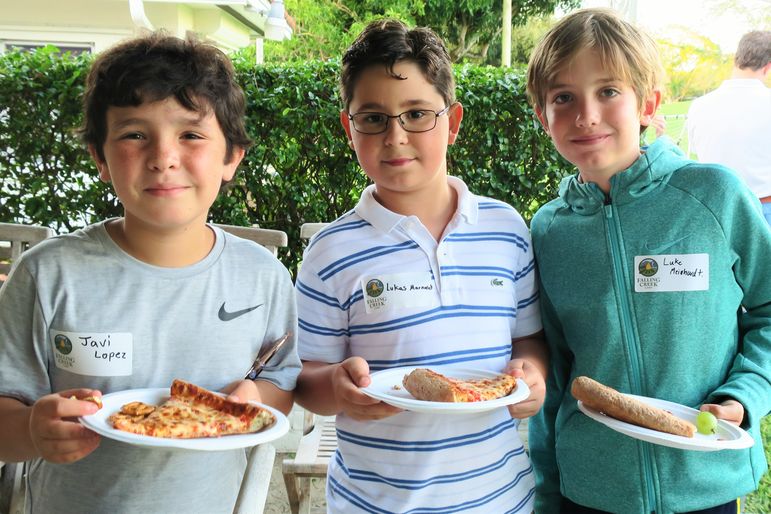 Enjoying some pizza and conversation.