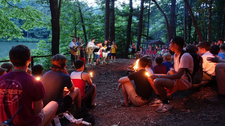 Lighting our candles to close out Campfire