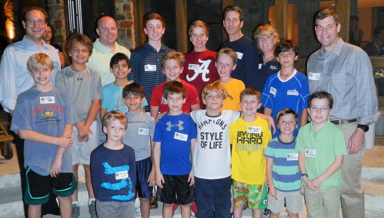 Returning campers, boys who came to learn more about FCC, alumni, and dads who attended Father/Son Weekend pose for a group photo.