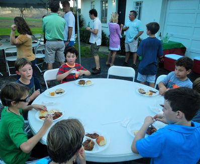 Enjoying each others company eating supper before the camp movie.