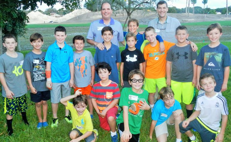 Bill Holly joined Yates and the boys for a group photo. Bill has been to Father/Son Weekend with his boys several times.