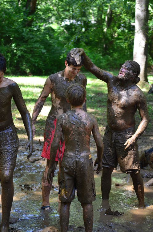 Mickey jumping into the mud pit with the campers and staff at the annual 4th of July picnic by the Green River