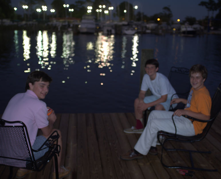 Campers Matthew Torack, Ward Jarvis, and Issac Gilman enjoy reconnecting on the dock