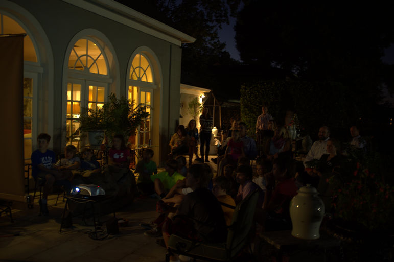 FCC campers and families enjoying watching the new camp movie outside in the beautiful 71 degree temperature