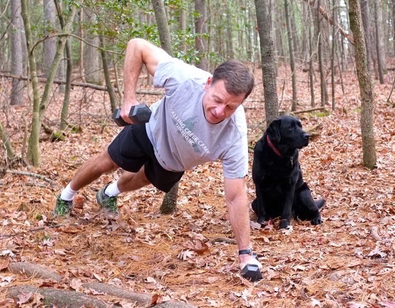 Frank (and Lulu) at one of the exercise stations stations on the new Falling Creek Camp fitness trail