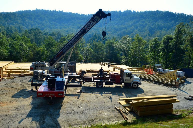 The crane set the steel framing and the large wooden timbers that hold up the 12’ wide wrap around porch