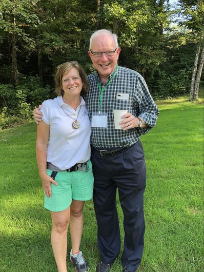 Founding Camper, Phil Walker, and Marisa Pharr mingling on the Grassy Knoll