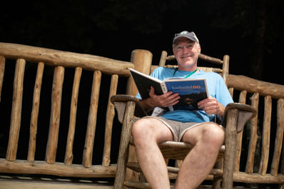 Judson Randolph enjoying the gift for the weekend, our new book, Behold50, a celebration of the past 50 summers