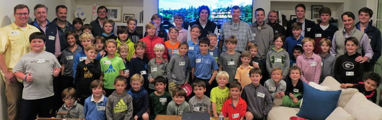 The Dads who attended Father/Son Weekend joined FCC alumni, staff, and the boys for a photo of the big turnout at the Ridinger’s home.