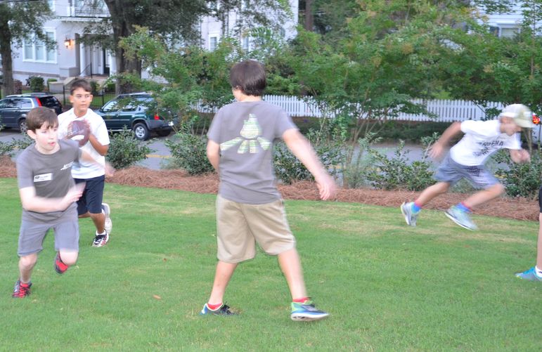 The boys enjoyed some football and pizza before Yates greeted them and showed the new camp movie.