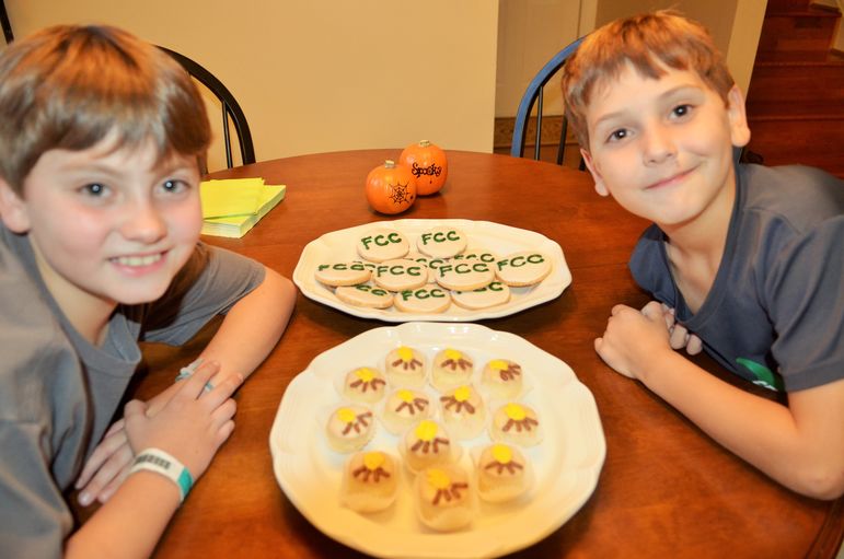 Webb and Boyd Hodges help their parents with hosting tonight and they were excited to show off the delicious FCC cookies and special cupcakes the Hodges prepared. The boys will be returning to camp in 2016.