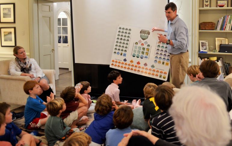 Yates explained the Waypoints program where the boys and staff can earn waypoint markers to be placed on the map that every first year camper and staff receive. These markers tell a story about their experience at Falling Creek.When a camper earns Ranger and Warrior in any activity, the two highest levels, their name is added to the progression wall permanently. This display of names is located on the wall of the side porch of the Dining Hall.