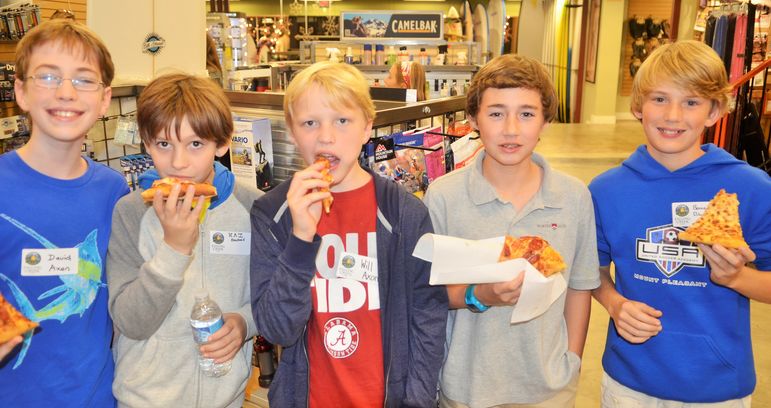 The boys enjoyed getting together and eating some pizza.