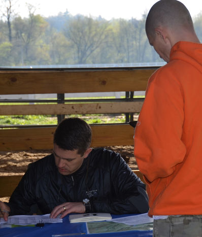 Will Hendricks, HCYLP Board Chair, signing in a racer